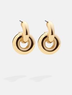 Tie up your outfit's loose ends with a bold new twist. Introducing the Camilla Earrings. Sleek and subtle earrings designed in a cool knotted shape. Available in either classic gold or sparkling pavé, these earrings are chic and classic for both everyday and elevated styling. 80s Gold Earrings, Chic Gold Earrings For Workwear, Chic Gold Earrings For Work, Elegant Metal Jewelry For Work, Gold Metal Jewelry For Workwear, Bold Gold Earrings, Chic Gold-tone Earrings For Evening, Chic Wrap Drop Earrings, Modern Twist Earrings For Formal Occasions