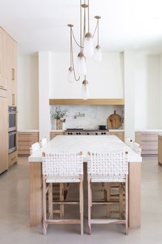 a large kitchen with an island in the middle