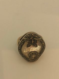 Vintage hand made about an in long Mother of Pearl set in 925 Sterling Silver Marcasite ring I have size 5.5 Can be re sized for you, my jeweler would charge $10 All rings are shipped in a nice gift box. Check out our over a THOUSAND great reviews Engraving is $4 per letter and is not always perfect depending on the piece. It can take a few days if the jeweler is busy. This is payable to Paypal Judithsltd@gmail.com Victorian Pearl Ring Gemstone Gift, Victorian Pearl Ring With Gemstone For Gift, Victorian Pearl Ring Gift, Victorian Style Pearl Ring Gift, Unique Sterling Silver Butterfly Ring, Sterling Silver Butterfly Ring For Wedding, Unique Oval Pearl Ring In Sterling Silver, Unique Sterling Silver Butterfly Ring For Wedding, Vintage Handmade Butterfly Ring Gift