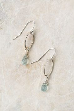 Experience the beauty of these exquisite earrings featuring a sterling silver wire wrapped aquamarine birthstone. Perfect for those born in March! Sterling Silver (lead and nickel free) Aquamarine On sterling silver ear wires We hand select our natural materials, thus there may be slight variations in color and/or size that will not detract from the overall aesthetic Our unique handcrafted designer jewelry for women is made in America, with each design created individually in our personal design Elegant Aquamarine Nickel-free Earrings, Silver Oval Wire Wrapped Earrings, Oval Silver Wire Wrapped Earrings, Silver Aquamarine Gemstone Earrings, Silver Aquamarine Dangle Earrings, Silver Briolette Jewelry For May Birthstone, Minimalist Sterling Silver Earrings For May Birthstone, Delicate Silver Birthstone Earrings, Silver Briolette Earrings With Birthstone