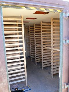 the inside of a storage room with wooden slats