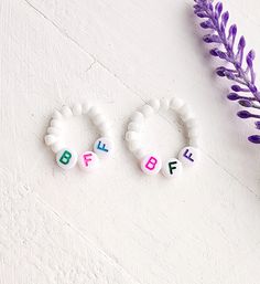 Thess BFF stretchy bead rings are the perfect gift for you and your bestie! Simple and cute and make a great statement! How to order Choose a size for ring ( Small Child Ring Size 4 to 5-Adult Med will be for sizes 5-7 Adult Large 8-10) Add an initial or BFF to personalization box. Add to cart to purchase. Handmade with love and care Bead Rings Straightener, Adjustable White Initial Ring As A Gift, Adjustable White Initial Ring Perfect For Gifts, Adjustable White Rings For Birthday, Rings For Bff, Trendy White Beaded Rings, Bff Rings, Dachshund Jewelry, Stacked Beaded Bracelets