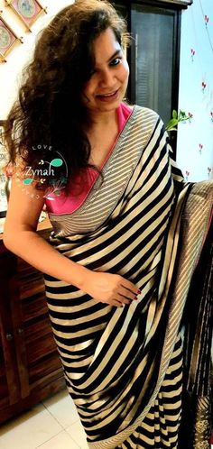 Update! - Zynah covered by LBB - https://lbb.in/bangalore/zynah-designs-handloom-sarees/ Banarasi pure georgette woven saree, decorated with intricate design. Their special characteristics are Mughal inspired designs such as intricate interwining floral and foliate motifs. Other features are gold/Silver work, compact weaving, figures with small details, metallic visual effects, pallus, jal (a net like pattern). Depending on the intricacy of its designs and patterns, a saree can take from 15 days Khaddi Georgette Banarasi Saree, Georgette Banarasi Saree, Sarees Banarasi, Readymade Blouse, Banarasi Saree, Silver Work, Beautiful Drapes, Small Details, Small Detail