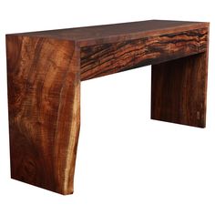 a wooden table that is made out of wood and has a long edge on it