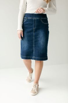 Simple lines, classic and comfortable, the 'Sara' is everything a denim skirt should be. This skirt is made from a quality stretch denim and is as comfy as they come! Featuring a wide waistband for extra comfort and ease of styling. Exclusively designed by us for you. 85% Cotton 12% Polyester 3% Spandex Machine Wash Cold Do Not Bleach Hang to Dry Low Iron if Needed Do Not Dry Clean Functional Back Pockets Available in 21", 24", and 26" length Model A Height 5'8" | Wearing Size 10 in 26" Length M Dark Denim Skirt, Everyday Skirts, Denim Skirts Knee Length, Long Denim Skirt, Modest Skirts, Denim Skirt Women, Nursing Clothes, Knee Length Skirt, Dark Wash Denim