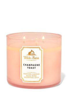 a pink candle that is sitting in front of a white background with the words champagne toast on