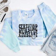 Get ready to fall in LOVE with your new tie-dye Certified Nursing Assistant (CNA) sweatshirt. It's the cutest and most comfortable way to show off the latest styles. Also makes a great gift! * PRODUCT DETAILS * ✺ 80% ring-spun cotton, 20% polyester ✺ Medium heavy weight fabric  ✺ Designed and printed in the USA ✺ Slight color variations may occur due to the dyeing process.✺ * SIZING * ✺ FOR AN OVERSIZED FIT, SELECT TWO OR THREE SIZES UP FROM YOUR NORMAL SIZE ✺ ✺ Sizing is unisex ✺ Size guide: Pl Tie Dye Cotton Sweatshirt For Loungewear, Cotton Tie Dye Sweatshirt For Loungewear, Tie Dye Cotton Sweatshirt Relaxed Fit, Tie Dye Relaxed Fit Cotton Sweatshirt, Relaxed Fit Cotton Tie-dye Sweatshirt, Relaxed Fit Tie Dye Cotton Sweatshirt, Cotton Tie Dye Sweatshirt, Casual Tie Dye Crew Neck Sweatshirt, Tie Dye Long Sleeve Sweatshirt With Letter Print