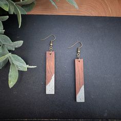 "Bar Wood and Concrete Earrings hand made, cut and sanded in the Red Shed's workshop. Made of beautiful rosewood. These are a part of our Wood & Concrete Collection. These are truly unique and one of a kind wood earrings. Earring measures approximately 2\" length x 3/8\" width x 1/8\" thickness The earrings come with bronze hooks. At Red Shed Designs we create unique hand-crafted wood and concrete jewelry pieces to make a bold statement. Very sleek statement pieces that will be sure and spar Concrete Bar, Shed Designs, Red Shed, Bar Wood, Phoenix Jewelry, Wood And Concrete, Concrete Jewelry, Bridesmaid Earrings Gold, Cobalt Blue Earrings