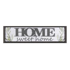 a sign that says home sweet home with leaves on the front and bottom, in black lettering