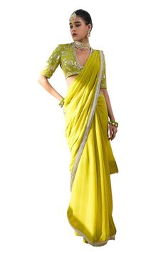 Lime green saree with lace detailing on the hem. Paired with a floral sequin embroidered, padded blouse featuring lace and pearl detailing around the neckline. - Aza Fashions Designer Green Pre-draped Saree With Embroidered Border, Elegant Green Lehenga With Embroidered Border, Festive Green Pre-draped Saree With Embroidered Border, Green Georgette Saree With Embroidered Border, Green Sharara With Embroidered Border For Navratri, Green Sharara With Embroidered Border For Wedding, Green Embroidered Border Saree For Reception, Green Pre-draped Saree With Embroidered Border For Wedding, Green Embroidered Sharara For Wedding