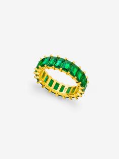 This gold eternity ring with emerald green stones is perfect for adding a pop of colour to your everyday outfits this season.  Wear it alone for a minimalistic look or stack it with our popular eternity ring for an extra sparkle: https://www.etsy.com/uk/listing/874164678/gold-eternity-ring-white-cubic-zirconia 𝗚𝗢𝗢𝗗 𝗧𝗢 𝗞𝗡𝗢𝗪 Forget the fear of tarnishing, skin irritation or green staining; you deserve better than that. We work with only the finest 18 Carat Gold and Sterling Silver which Emerald Green Jewelry, Green Stone Jewelry, Green Jewellery, Gold Eternity Ring, Emerald Green Stone, Ring With Emerald, Valentine Gift For Wife, Eternity Ring Gold, Emerald Ring Gold