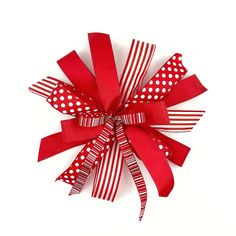 a red and white bow with polka dots on it