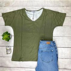 Get Ready To Fall In Love With The Fit And Fabric Of This Olive V-Neck Top. It Has A V Neck Line, Longer Short Sleeves, And A Slight Dolman Look. The Body Is A Relaxed Fit With Still Bringing That Feminine Look To It. This Will Sure To Be Your Newest Grab And Go Favorite! Fit: Runs True To Size With High Stretch. Material Is 95% Polyester And 5% Spandex Measurements: Chest 18.5” Body Length 25.6” Sleeve Length 10.6” Search Purposes Only: Casual Office Top Work Top Comfortable Trendy Fall Tops Wi Casual Solid Color V-neck Top For Summer, Spring V-neck Stretch T-shirt, Casual Solid Color V-neck Top For Spring, Casual V-neck Top For Spring, Casual V-neck Tank Top For Spring, Casual Stretch V-neck Top For Summer, Spring Everyday V-neck Top, Green V-neck Casual Top, Casual Green V-neck Top