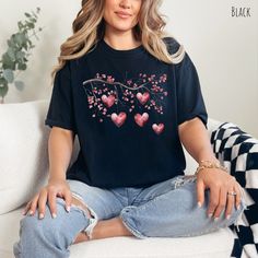 👀Images are an accurate depiction of what you'll receive upon purchase ♂️ All Shirts are Unisex Sizing 👣 Printing is "Direct To Garment"  (Ink printed). 💖Indulge in the romance of nature with our "Love in Bloom" Comfort Colors T-shirt, a charming tribute to the beauty of cherry blossoms and the warmth of love. Crafted on the incredibly comfortable canvas of a Comfort Colors shirt, this tee is more than just clothing--it's an expression of the delicate intertwining of nature and affection.  💗 Cherry Blossom Shirt, Valentines Day Shirts, Valentine Heart, Graphic Tees Women, Tshirt Colors, Cherry Blossom, Comfort Colors, Blossom, Valentines Day