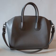 Silver-Toned Givenchy Hardware Goatskin 1interior Slip Pocket 1interior Slip Media Pocket 11 Regular Zip Interior Pocket Top Width Is 16” Base Width Is 13.1” Depth Is 7.5” Height Is 11.2” Strap Drop Is 11.2” Handle Drop Is 3.3” Pic With Model Is To Show Bag Size Only. Wear On Top Handles, Bag Edges, And Some Of The Piping. Scratch Between Back Handle Notches. Minor Scratch Near Front Bag Edge. Lining Has Marks That May Clean Out. Otherwise In Amazing Condition. Interior Is Black. A Gorgeous Pre- Givenchy Bags, Givenchy Bag, Pocket Top, Clean Out, Givenchy, Silver Tone, Purse, Silver, How To Wear