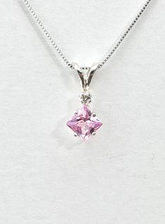 Square pink amethyst has a pink/ lavender color and measures 5.5mm x 5.5mm ( 1 carat). Tiny genuine accent diamond. Both stones were handset in sterling silver. Sterling silver box chain is 18 inches long. Comes in a gift box Pink Diamond Necklace For Formal Occasions, Lavender Amethyst Jewelry With Diamond Accents, Purple Amethyst Necklace With Diamond Accents, Pink Necklace With Diamond Accents Gift, Purple Diamond Pendant Necklace, Pink Diamond Necklace Gift, Pink Necklaces With Diamond Accents For Gift, Pink Diamond Necklace As Gift, Pink Diamond Necklace For Gift