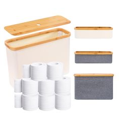 several rolls of toilet paper next to a bamboo cutting board and storage bin with dividers