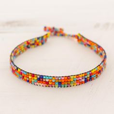 Spiritual Multicolor Adjustable Wrap Bracelet, Colorful Beaded Adjustable Bracelets, Adjustable Multicolor Tiny Beads Jewelry, Adjustable Colorful Beads Wrap Bracelet, Adjustable Beaded Wrap Bracelet Bangle, Adjustable Tiny Beads Wrap Bracelet Gift, Adjustable Beaded Wristband For Festival, Multicolor Braided Bracelets With Tiny Beads As Gift, Handmade Adjustable Rainbow Beaded Bracelets