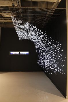 an art installation is displayed in the middle of a room