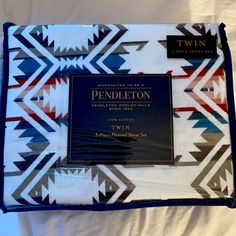 the pendleton blanket has been folded up to show its company's logo and name