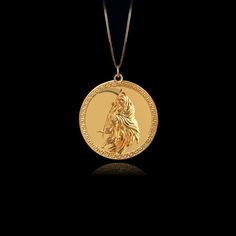 Our Gold Santa Muerte Pendant, crafted in the USA from real solid gold, embodies devotion and protection. This timeless piece showcases exquisite craftsmanship, designed to last a lifetime. Perfect for those seeking a unique and meaningful symbol, this pendant is a testament to enduring quality and elegance. PENDANT INFORMATIONThis pendant is made of real, solid gold.• Made in USA• Material: 14k or 18k solid gold• Finish: polished• Height: 1.13" (29 mm) x Width: 1" (26 mm)• Pendant weight: appro Ceremonial 14k Gold Amulet Jewelry, Ceremonial 14k Gold Medallion Jewelry, Elegant Ceremonial Coin Jewelry, Ceremonial 14k Gold Round Pendant Jewelry, Ceremonial Symbolic Yellow Gold Jewelry, Ceremonial Yellow Gold Coin Jewelry, Luxury Gold Jewelry For Commemoration, 14k Gold Medallion For Ceremonial Use, Luxury 14k Gold Jewelry For Commemoration