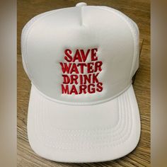 a white trucker hat with the words save water drink margs embroidered on it