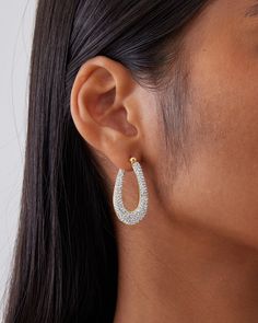 This is a mid-sized hoop earring set with over 300 pcs of micro pavé crystals. The design is elegant, sophisticated and a lot of sparkle and bling. The earring uses the crystal luster setting technique which creates lusters that shines and sparkles. This earring is made in 18K yellow gold or white gold plated over 925 sterling silver. Each piece is hand polished to perfection. Closure: Hoop Stamp Approx. Measurement: Outer Length: 1.4 inches Outer Width: 35 inches Silver Weight: Approx. 0.18 oz Glamorous Teardrop Hoop Earrings For Pierced Ears, Glamorous Teardrop Hoop Earrings, Dazzling Rhinestone Crystal Earrings, Glamorous Crystal Rhinestone Hoop Earrings, Elegant Crystal Hoop Earrings With Bling, Elegant Crystal Hoop Earrings, Glamorous Rhinestone Crystal Hoop Earrings, Elegant Rhinestone Hoop Crystal Earrings, Glamorous Diamond Hoop Earrings With Sparkling Stones