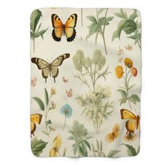 a blanket with butterflies and flowers on it