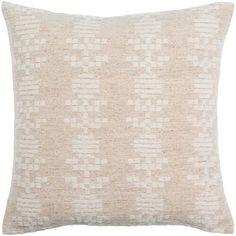 a beige and white pillow with an abstract pattern on the front, sitting on a white background