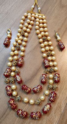 Jaipuri traditional beads three lear mala necklace with earrings Diamond, pearl, beads work  Beautiful big and long red with off white beads pearl Jaipur Design, Pearl Mala, Beads Design, Beads Work, Deco Earrings, Red Beads, Earrings Diamond, Feather Design, Mala Necklace