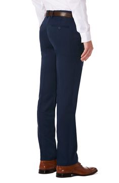 Slim-fit performance dress pants feature a flat front, subtle texture and a signature Rigid Waistband that provides a secure fit on your midsection. The moisture-wicking fabric has the added benefit of eliminating the need to iron making this pant a wardrobe staple. Zip fly with hook-and-bar closure Back besom pockets with button closure 100% polyester Machine wash cold, tumble dry low Imported Navy Fitted Elastane Bottoms, Navy Fitted Elastane Pants, Fitted Full-length Navy Dress Pants, Fitted Navy Dress Pants For Business Casual, Navy Fitted Dress Pants For Business Casual, Navy Fitted Dress Pants For Work, Classic Navy Stretch Bottoms, Navy Classic Stretch Bottoms, Navy Fitted Bottoms For Semi-formal Occasions