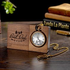 Personalized Engraved Wooden Pocket Watch with Stand - Father's Day Gift, Anniversary Gift for Him, Groomsmen Watch Description: Looking for a gift that will make a statement? Look no further than this incredible custom pocket watch! With its sleek design and stunning snakewood watch stand, it's sure to impress. Personalization: But that's not all - you can also personalize this pocket watch with your own message on the watch stand and/or back side of the watch. Make it a truly special gift by adding a heartfelt engraving. Perfect Gift for Various Occasions: This pocket watch is the perfect anniversary gift for him, a thoughtful Father's Day present, or a memorable token for milestones like a 21st birthday. It's also an ideal choice for groomsmen's gifts. No matter the occasion, this perso Vintage Chronograph Watch With Chronometer As Gift, Vintage Chronograph Watch As Gift, Gold Watch Accessories With Date Display For Gift, Timeless Watch Accessories With Date Display As Gift, Brown Chronometer Watch For Gift, Brown Chronometer Watch As Gift, Personalized Formal Watches For Father's Day, Personalized Watches With Round Dial For Gifts, Personalized Watches As Gifts