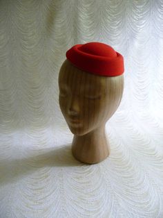 "Molded faux felt pillbox style fascinator hat base in pretty lipstick red that measures 6.5\" x 5.5\" - and has a contoured shape to fit on the head. Low side is approximately .75\" and the higher side is approximately 1.5\". Just attach an alligator clip inside or an elastic to make this a breeze to wear. A cute little base ready for your next DIY millinery project. Easy to decorate with many of the flowers and leaves available in my shop! (PLEASE NOTE this is a FASCINATOR SIZE HAT BASE not a Fitted Formal Flat Cap Felt Hat, Fitted Felt Party Hats, Elegant Fitted Red Felt Hat, Red Fitted Felt Hat For Formal Occasions, Classic Red Felt Hat For Formal Occasions, Red Fitted Vintage Top Hat, Red Fitted Felt Hat For Kentucky Derby, Fitted Red Felt Hat For Kentucky Derby, Classic Red Formal Felt Hat