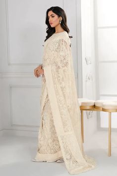 Brand: BaroqueProduct Code: BQU-UF-D287Collection: Chantelle Unstitched Luxury Formals CollectionFabric: Net DESIGN DETAILS: Embroidered net blouse front Embroidered grip front patch Embroidered organza neckline patch Embroidered net saree fall (02) Embroidered net saree palu Embroidered net sleeves Embroidered grip sleeves patch Embroidered grip side border patch Dyed silk trouser DISCLAIMER:* Lining, Laces, and Tassels are not included in unstitched variants.* Embellishment items in stitched outfits are subject to market availability.* Product color may vary due to photographic lighting or your device settings. CARE INSTRUCTIONS: Extra Fabric Has Been Used For Shoot Original Color May Vary Slightly From The Picture Dry Clean Recommended Iron The Clothes At Moderate Temperature Do Not Use Saree Modern, Net Sleeves, Pakistani Boutique, Side Border, Net Blouse, Shadi Dresses, Branded Outfits, Net Blouses, Pakistani Lawn Suits