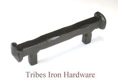 a black iron handle on a white background with the words tribe's iron hardware