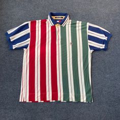 DESCRIPTION Vintage Tommy Hilfiger Striped Sailing Gear Rugby 90s Short Sleeve shirt Condition : Used Condition,refer picture Size on tag : M Measurement : Armpit to armpit 22.5"  length 28" Material :  SHIPPING Shipping duration is vary depending on location..all item is ship using EXPEDITED SHIPPING by DHL or FEDEX with tracking and usually will arrive within 3 - 5 working days PAYMENT We accept PayPal only. The item will be sent within 3 days after payment is completed. I am happy to offer a Casual Collared T-shirt With Patchwork, Casual Collared Patchwork T-shirt, Retro Striped Streetwear Tops, Multicolor Polo Collar Top With Graphic Print, Multicolor Graphic Print Polo Collar Top, Multicolor Graphic Print Top With Polo Collar, Retro Striped Tops For Streetwear, Vintage Green Short Sleeve Polo Shirt, Retro Green Patchwork Tops