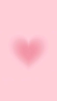 a heart shaped object on a pink background