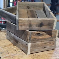 two wooden boxes sitting on top of a table