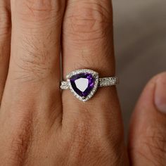 This is a gorgeous handmade creation. Its beauty is its simplicity & Elegance. The 8*8mm trillion shape faceted amethyst is crafted in solid sterling silver and with rhodium plated. All item is sent in a beautiful gift box You can realize more lovely stuff clicking the link https://www.etsy.com/shop/knightjewelry?refshopsection_shophome_leftnav Please leave the correct address and you phone number for delivering successfully. Trillion Cut Birthstone Ring For Promise, Trillion Cut Birthstone Promise Ring, Trillion Cut Center Stone Jewelry Gift, Trillion Cut Halo Setting Jewelry For Gift, White Gold Jewelry With Trillion Cut Accent Stones, Trillion Cut Diamond Ring With Accent Stones As Gift, Trillion Cut White Gold Jewelry With Accent Stones, Trillion Cut Gemstone Birthstone Ring For Anniversary, Trillion Cut Gemstone Birthstone Ring For Wedding