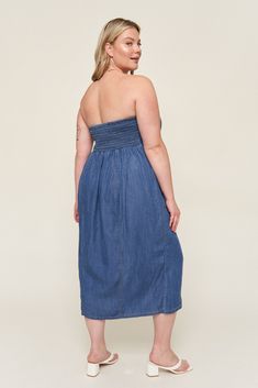 The "Tahoma" dress is everything you love about denim dressing, with all the comfort of breezy linen. This nostalgic piece is inspired by Lo's love for 90s styling and named after her favorite summer hideaway. This strapless style is fitted to be "bra optional" and has a shirred back panel for adjustability and support. Our favorite part about this dress? Besides the pockets, this baby has a gorgeous fixed button placket that ends with a split seam, giving this timeless piece an elevated look th Dark Wash Strapless Dress For Summer, Casual Blue Strapless Denim Dress, Summer Dark Wash Denim Dress For Casual Wear, Dark Wash Denim Dress For Summer, Summer Casual Denim Dress, Summer Dark Wash Denim Dress, Strapless Medium Wash Cotton Denim Dress, Strapless Medium Wash Denim Dress For Spring, Strapless Cotton Denim Dress For Spring