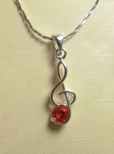 **Brand New**    ***In Stock And Ready For Shipment***     18K White Gold Plated Musical Note "Red" Cubic Zirconia  Designer Style Pendant  With Chain CZ Appx. 1/2ct  (18k GP Hallmark)   !!!! LIMITED TIME OFFER !!!!!   Don't Miss Out Order Today!! Makes a Great Gift!!     View My Feedback     Visit My eBay Store   Payment All payments through Paypal only. Use your credit card through Paypal...safe, secure and FREE. All payments must be made within 48hrs of purchase for Buy-it-now items, unless c Music Note Jewelry, Musical Note, Pendant With Chain, Designer Style, Music Notes, Hallmark, Limited Time, Ebay Store, Cubic Zirconia