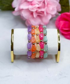 Elevate your wrist game with our Skipping Stones Bracelet Set in Multi – a vibrant and boho-inspired collection featuring 5 Row Ugly Stone Beaded Bracelets. This stretch bracelet set is perfect for those who love to embrace the beauty of natural stones in a trendy and eclectic design.
The Skipping Stones Bracelet Set ensures easy wear and a comfortable fit, allowing you to effortlessly layer your wrists with these unique and eye-catching pieces. The multi-colored stone beads add a playful and lively touch to your ensemble, making this set versatile for various occasions.
Whether you're attending a festival, embracing a bohemian-inspired look, or simply enjoying the art of stacking bracelets, the Skipping Stones Bracelet Set in Multi is a must-have addition to your jewelry collection. Multicolor Stackable Jewelry For The Beach, Multicolor Stackable Beach Jewelry, Multicolor Stackable Bracelets For Beach, Multicolor Stackable Stretch Bracelet For Beach, Colorful Adjustable Stackable Jewelry, Trendy Adjustable Multicolor Stretch Bracelet, Adjustable Stackable Colorful Jewelry, Beach Multicolor Stackable Bracelets, Bohemian Adjustable Stackable Stretch Bracelet