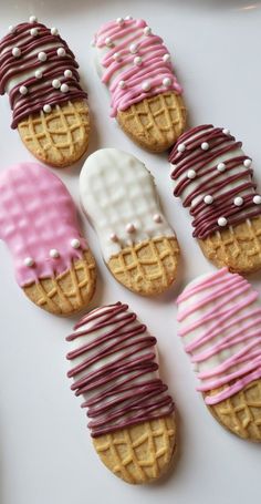 decorated cookies with icing and chocolate drizzles