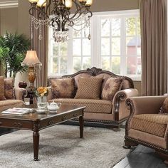 a living room filled with furniture and a chandelier