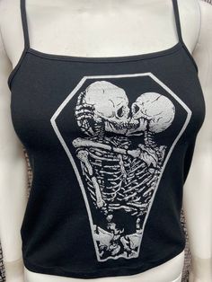 This is a black sleeveless Skeletons in a coffin cropped tank top.This has a Coffin image screen printed on the front in silver ink. 57% cotton/ 38% polyester/ 5% SpandexThese are handmade screenprinted and slightly vary from the photo. Please feel free to email me any questions. Thanks for looking. Gothic Crop Top, Skeleton Couple, Summer Goth, Black Cropped Tank, Black Crop Top Tank, Diy Clothes Life Hacks, Bodysuit Fashion, Goth Outfits, Black Sleeveless