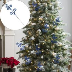 a decorated christmas tree with blue and white ornaments