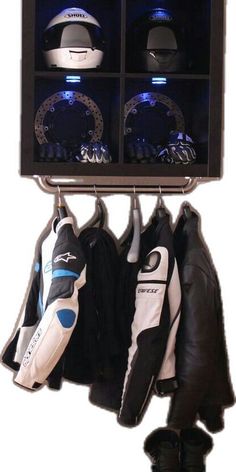 a pair of shoes hanging from a rack with hats and gloves on it's hooks