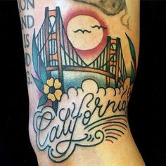 a tattoo with the golden gate bridge in san francisco, california on it's arm