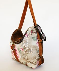 This versatile Retro Floral Backpack Women Convertible Bag is multi-functional and effortlessly transforms from a slouchy hobo bag to a trendy urban backpack in seconds. Crafted with a soft and durable material, it flaunts a charming retro floral design, adding a touch of nostalgia to your ensemble. With multiple compartments, you can easily organize and access your essentials on the go. The adjustable straps assure a comfortable fit, whether you prefer it as a purse or backpack. Choose convenience and style - this convertible bag is the perfect companion for your daily adventures, ensuring practicality without compromising fashion! The adjustable handles, in velvety leather, prevent it from slipping down the shoulder, making it very comfortable. A bag made with care, to be robust and dura Convertible Purse Backpack, Canvas Backpack Purse, Slouchy Hobo Bag, Convertible Backpack Purse, Urban Backpack, City Backpack, Floral Backpack, Bag Aesthetic, Backpack Women