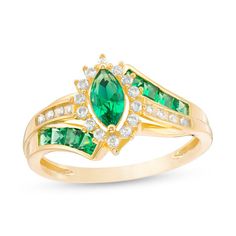 Complement her dressy attire with this show-stopping gemstone and diamond ring. Fashioned in warm 10K gold, this resplendent style features a 7.0 x 3.5mm marquise-shaped verdant-green emerald wrapped in a frame of sparkling diamonds. Rich channel-set princess-cut emeralds and shimmering round diamonds artfully adorn the sculpted bypassing ribbons of the split shank. Radiant with 1/6 ct. t.w. of diamonds, this ring is buffed to a brilliant luster. Marquise Emerald Ring With Center Stone For Anniversary, Green Marquise Ring With Diamond Accents, Green Marquise Rings With Diamond Accents, Yellow Gold Marquise Cut Rings With Accent Stones, Marquise Cut Yellow Gold Rings With Accent Stones, Emerald Birthstone Ring With Diamond Accents For Promise, Marquise Emerald Ring For Promise, Marquise Emerald Promise Ring With Center Stone, Emerald Birthstone Ring With Diamond Accents